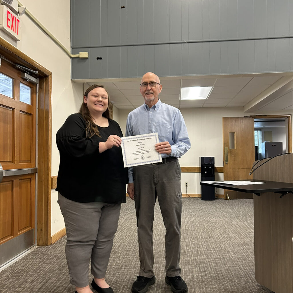 Hannah Ginn, UT, receiving 2nd-place award from chair Pat Parkman